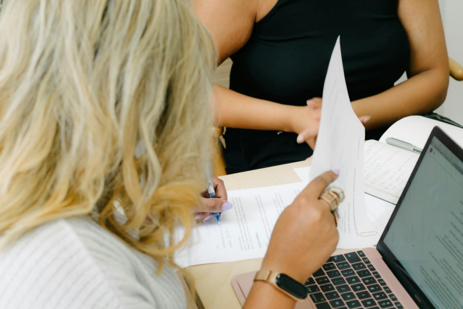 Professional analyzing financial reports and budget variance data